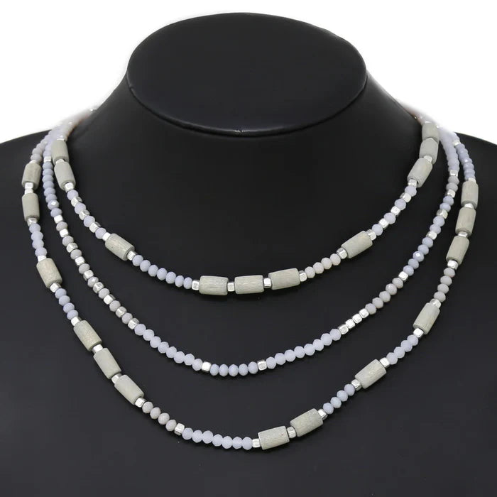 1. **Fernwood Whisper Necklace**  
2. **Twilight Glow Layered Necklace**  
3. **Elemental Harmony Beaded Necklace**
