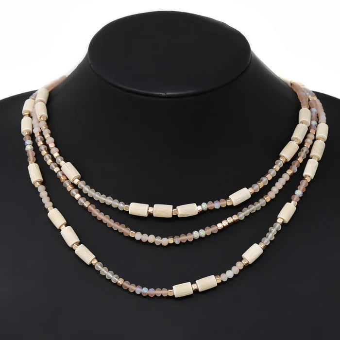 1. **Fernwood Whisper Necklace**  
2. **Twilight Glow Layered Necklace**  
3. **Elemental Harmony Beaded Necklace**